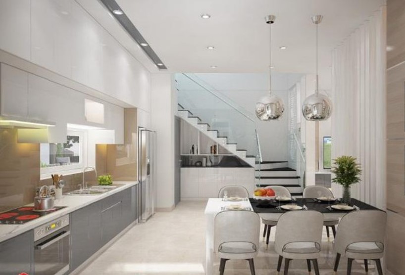 Bếp ăn được thiết kế với đường nét tinh gọn, hiện đại cùng tông màu trắng chủ đạo.